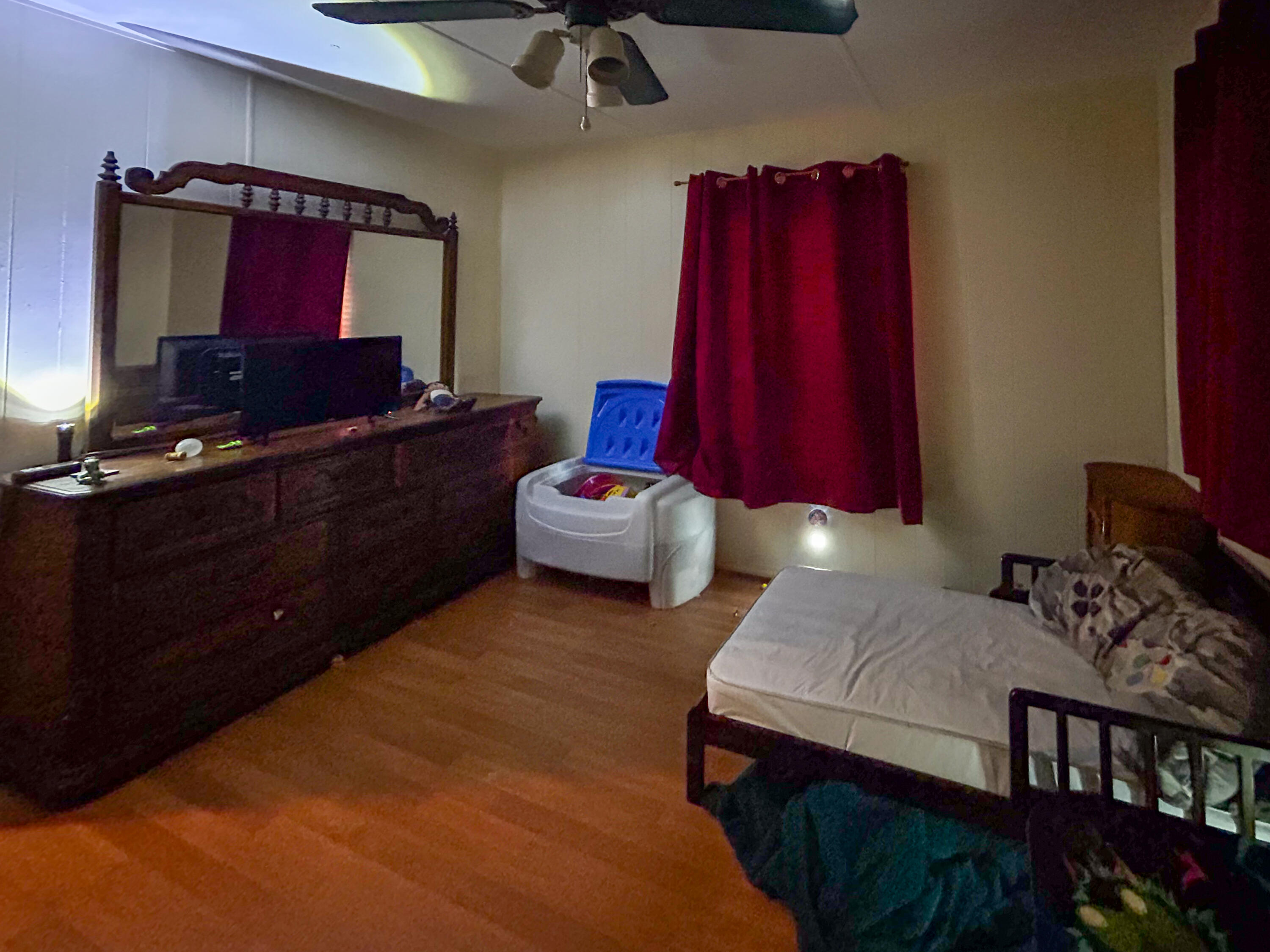 2446 Southeast Carroll Street Stuart, FL 34997 - Photo 22 of 37 a bedroom with furniture and a mirror