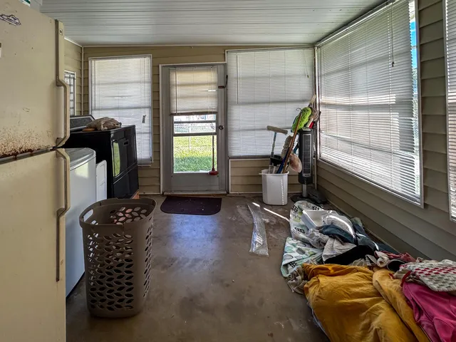 a view of a livingroom with furniture and windows