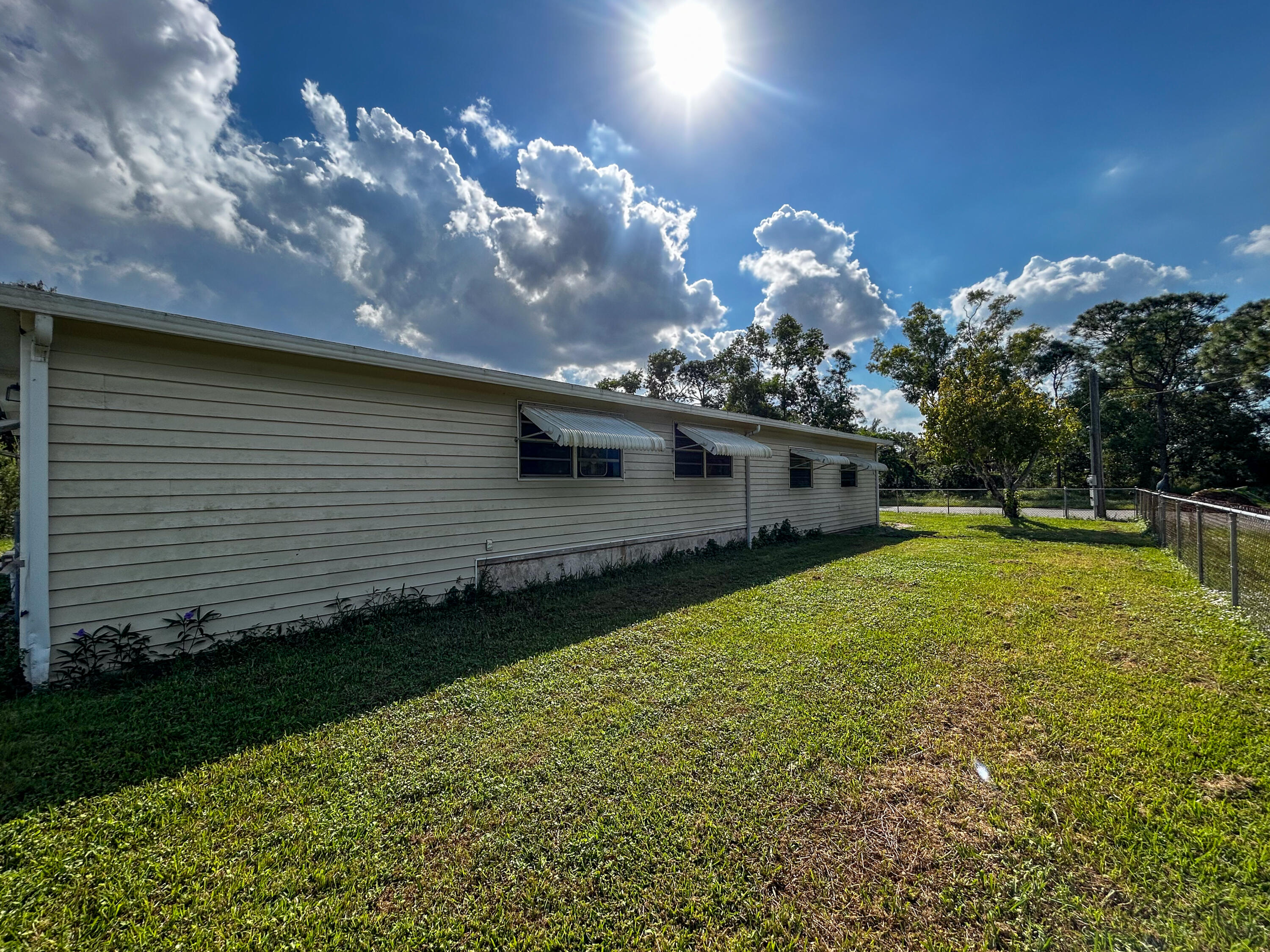 2446 Southeast Carroll Street Stuart, FL 34997 - Photo 35 of 37 a kitchen with a large tree