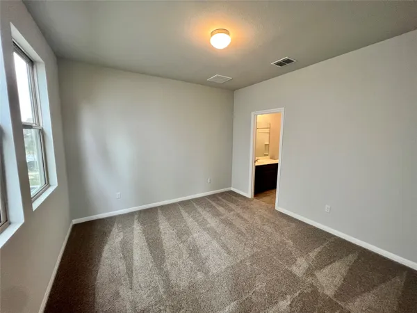 a view of a room with wooden floor and staircase