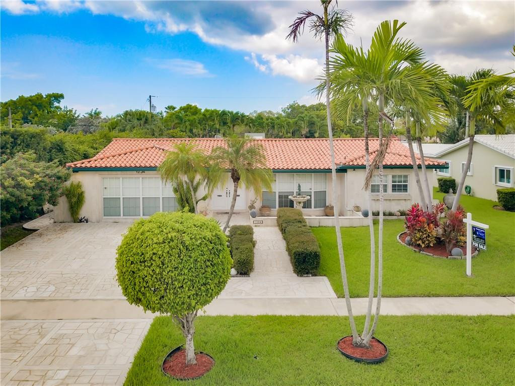 a swimming pool with outdoor seating and yard