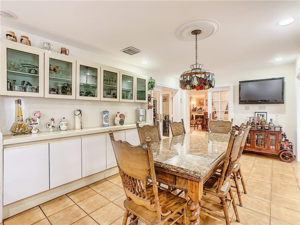 1234 Funston Street Hollywood, FL 33019 - Photo 13 of 23 a view of a dining room with furniture and wooden floor