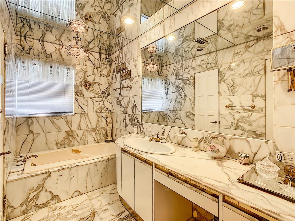 1234 Funston Street Hollywood, FL 33019 - Photo 14 of 23 a bathroom with a sink and a mirror