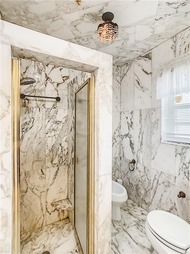 1234 Funston Street Hollywood, FL 33019 - Photo 15 of 23 a bathroom with a toilet and a shower curtain