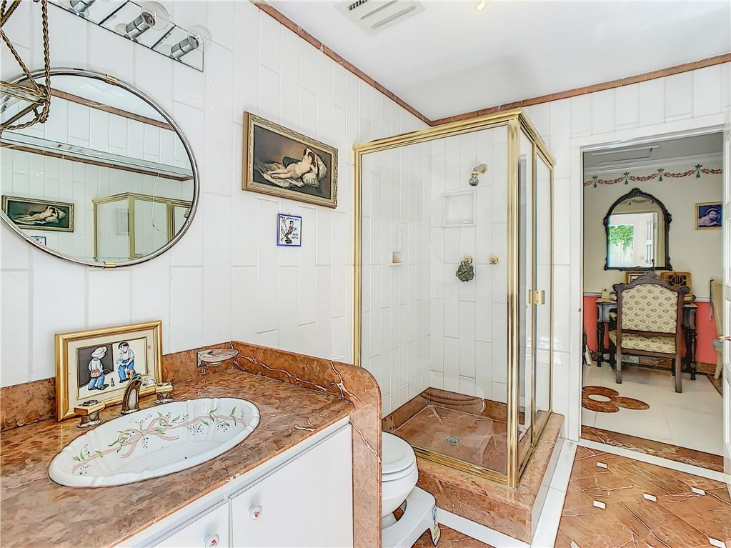 1234 Funston Street Hollywood, FL 33019 - Photo 17 of 23 a bathroom with a sink and a mirror