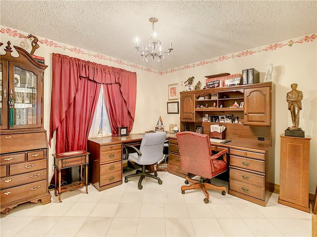 1234 Funston Street Hollywood, FL 33019 - Photo 19 of 23 a view of a workspace with furniture and a window