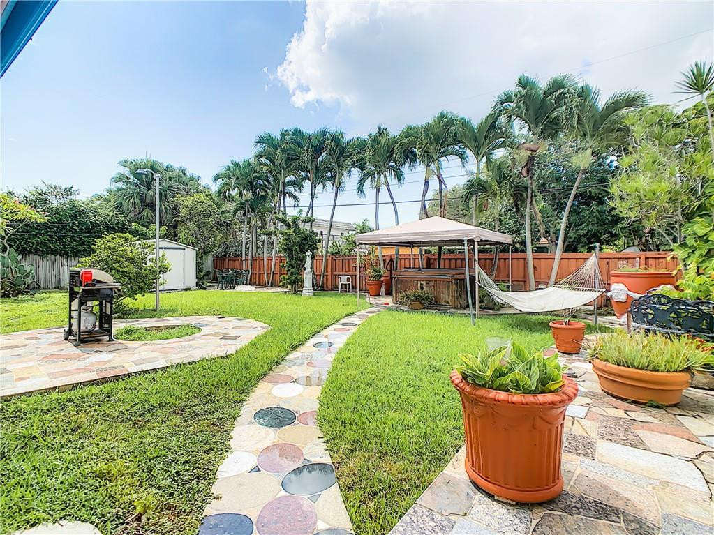 1234 Funston Street Hollywood, FL 33019 - Photo 22 of 23 a view of a garden with a patio