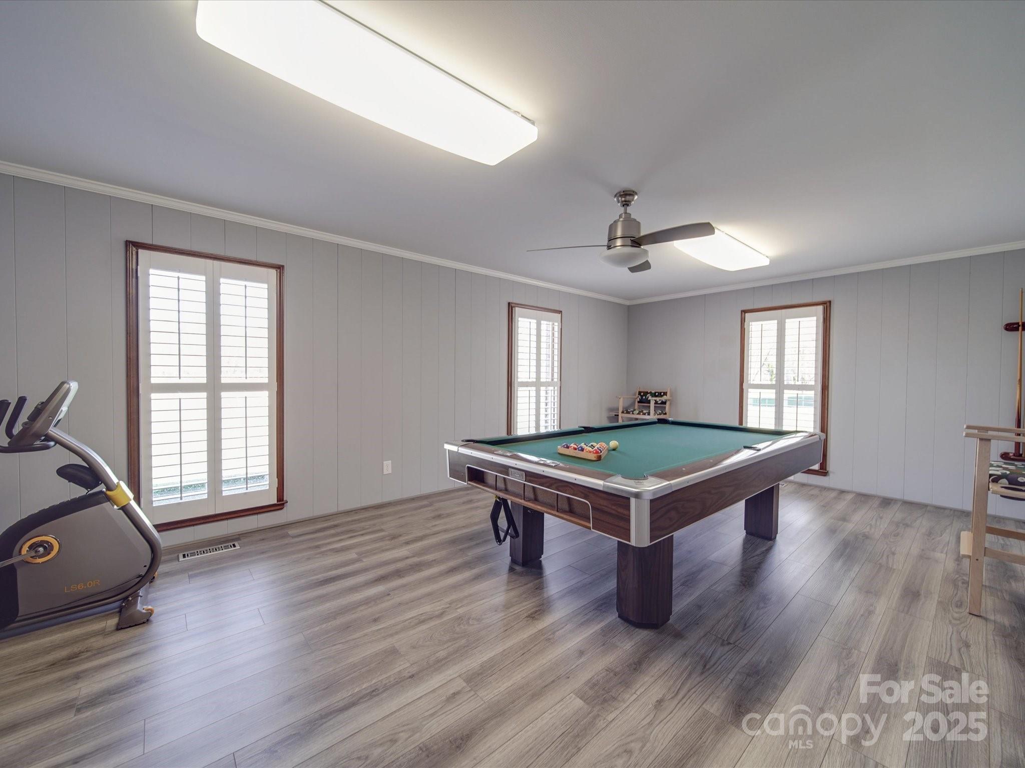 7169 Pleasant Grove Road Charlotte, NC 28216 - Photo 13 of 48 a room with pool table ceiling fan and windows
