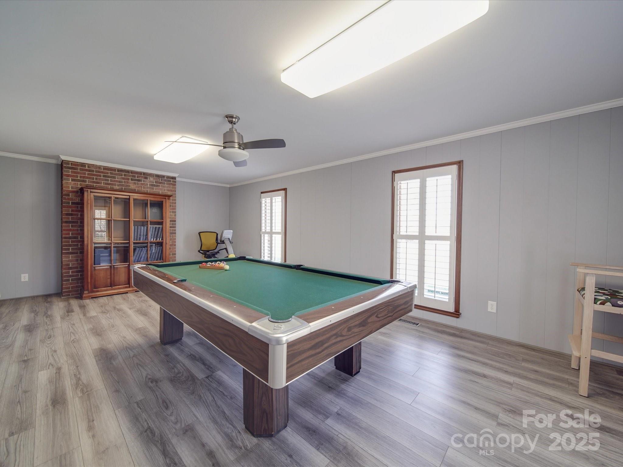 7169 Pleasant Grove Road Charlotte, NC 28216 - Photo 14 of 48 a room with pool table and windows