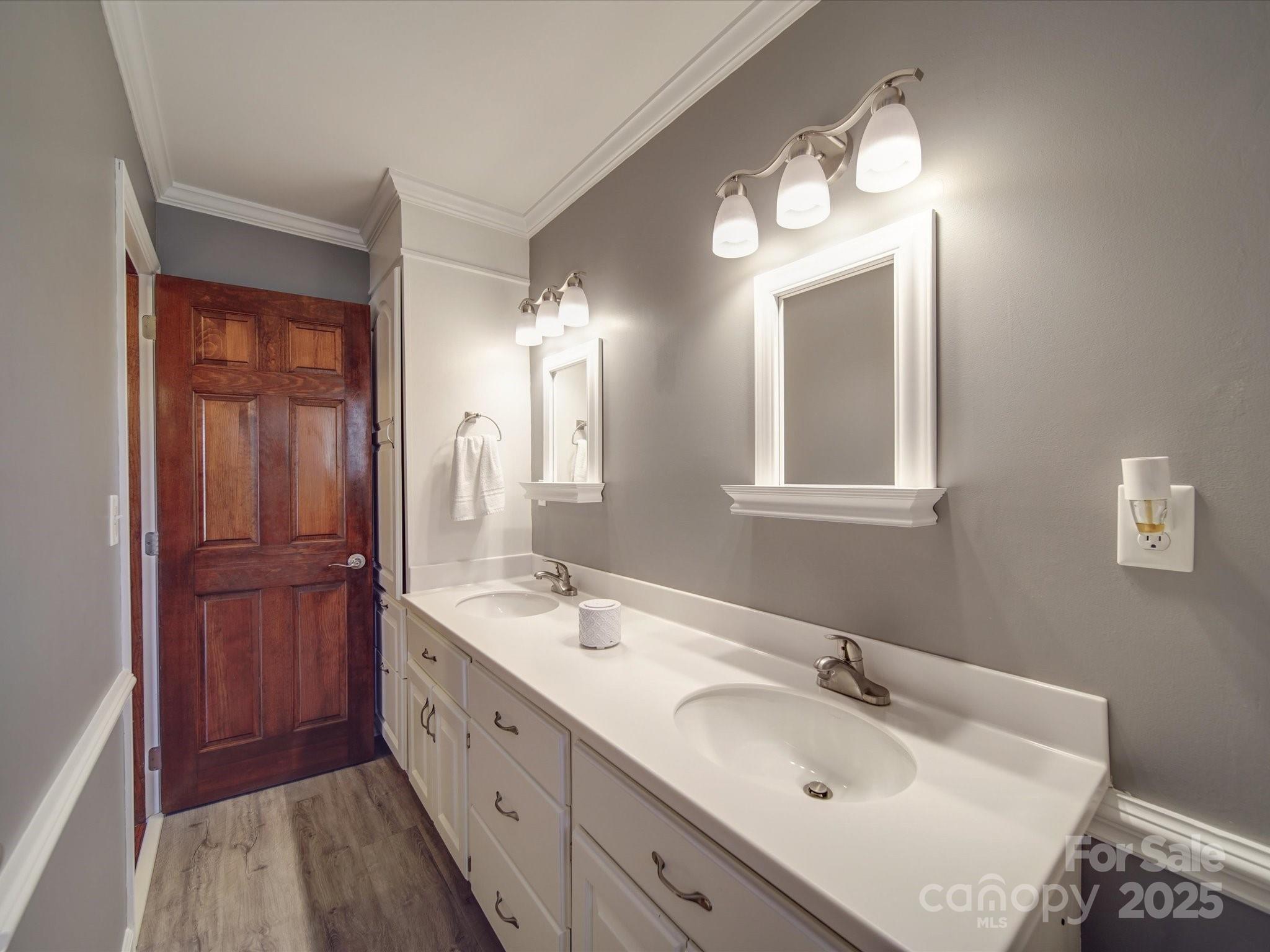 7169 Pleasant Grove Road Charlotte, NC 28216 - Photo 20 of 48 a spacious bathroom with a double vanity sink and a mirror