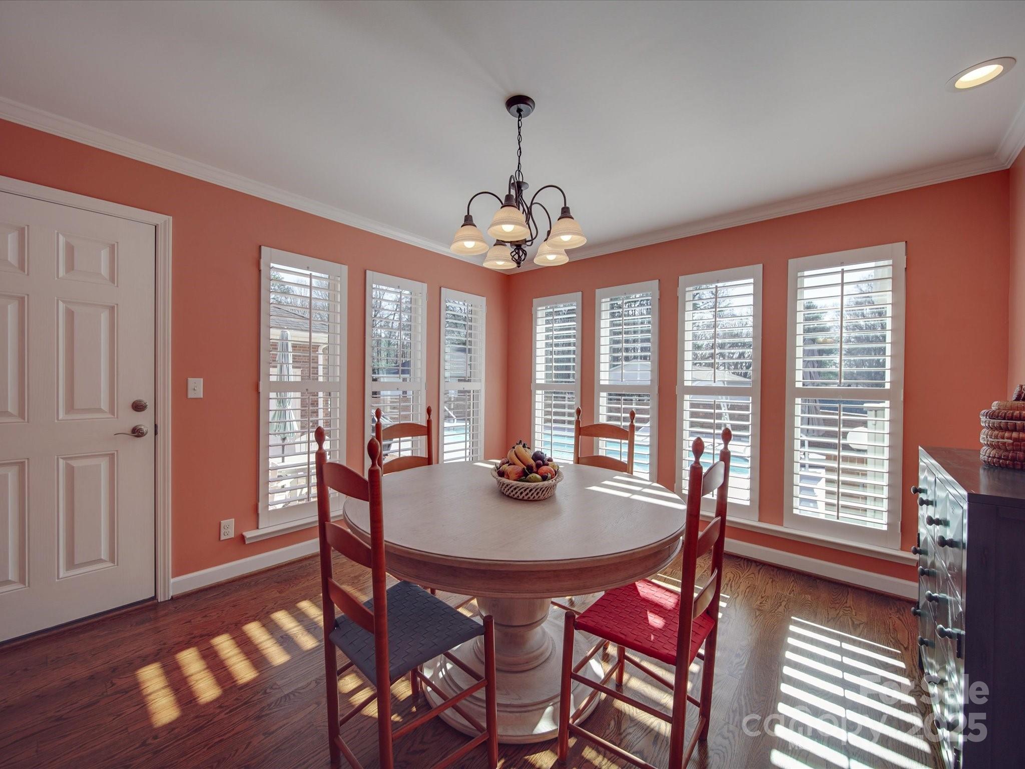7169 Pleasant Grove Road Charlotte, NC 28216 - Photo 27 of 48 a dining room with furniture window wooden floor