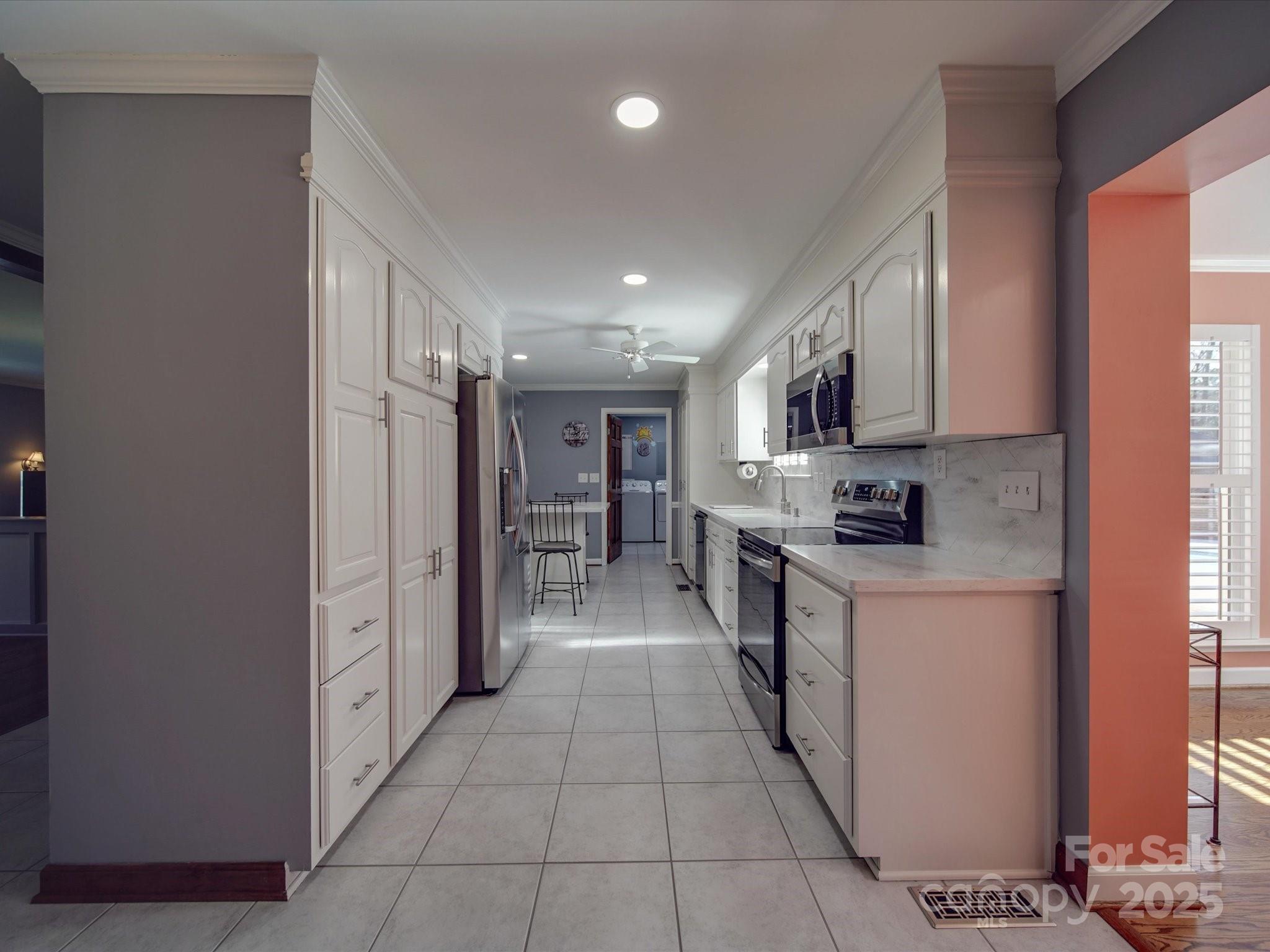 7169 Pleasant Grove Road Charlotte, NC 28216 - Photo 28 of 48 a kitchen with stainless steel appliances granite countertop a refrigerator and a stove