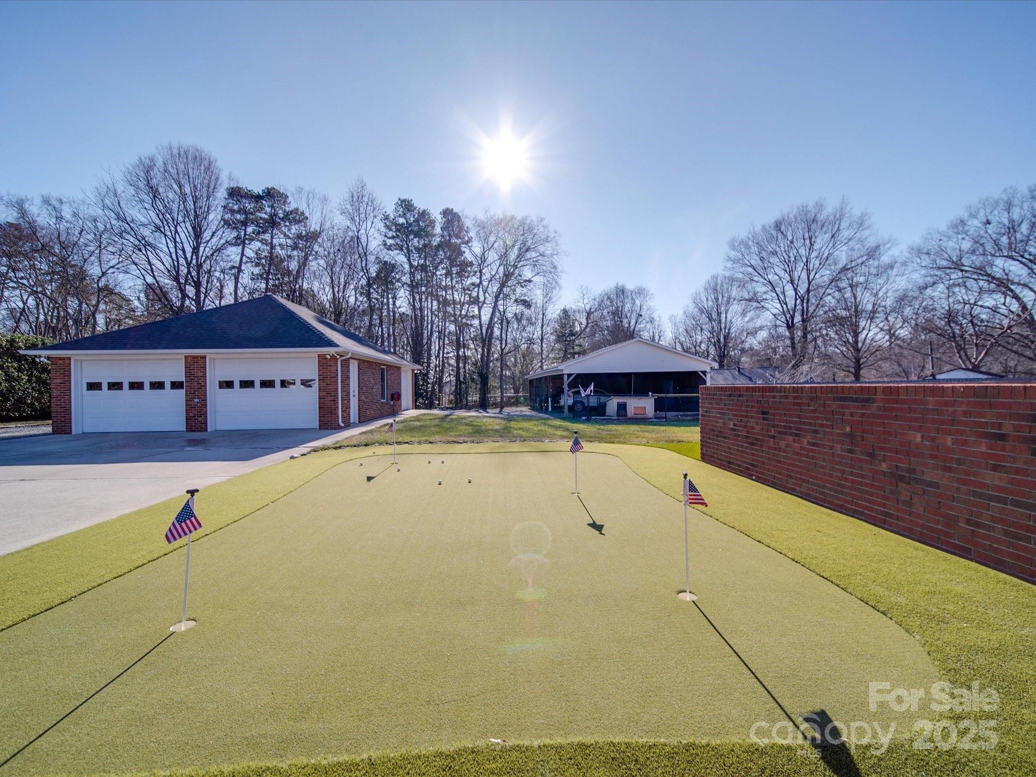 7169 Pleasant Grove Road Charlotte, NC 28216 - Photo 4 of 48 a view of swimming pool with trees in the background