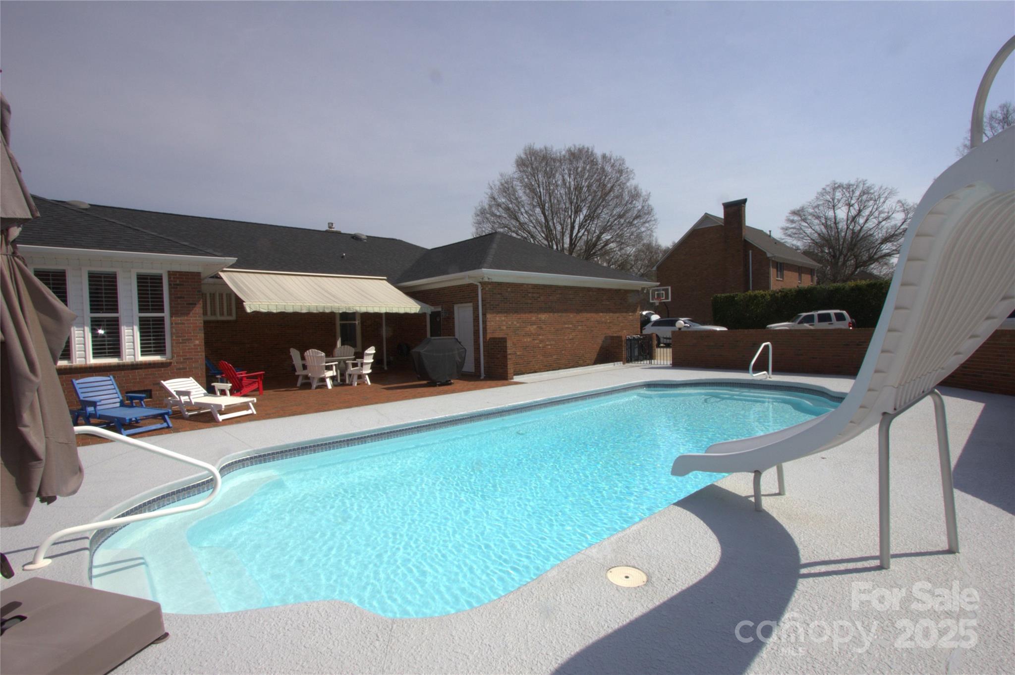 7169 Pleasant Grove Road Charlotte, NC 28216 - Photo 44 of 48 a view of a house with swimming pool and sitting area