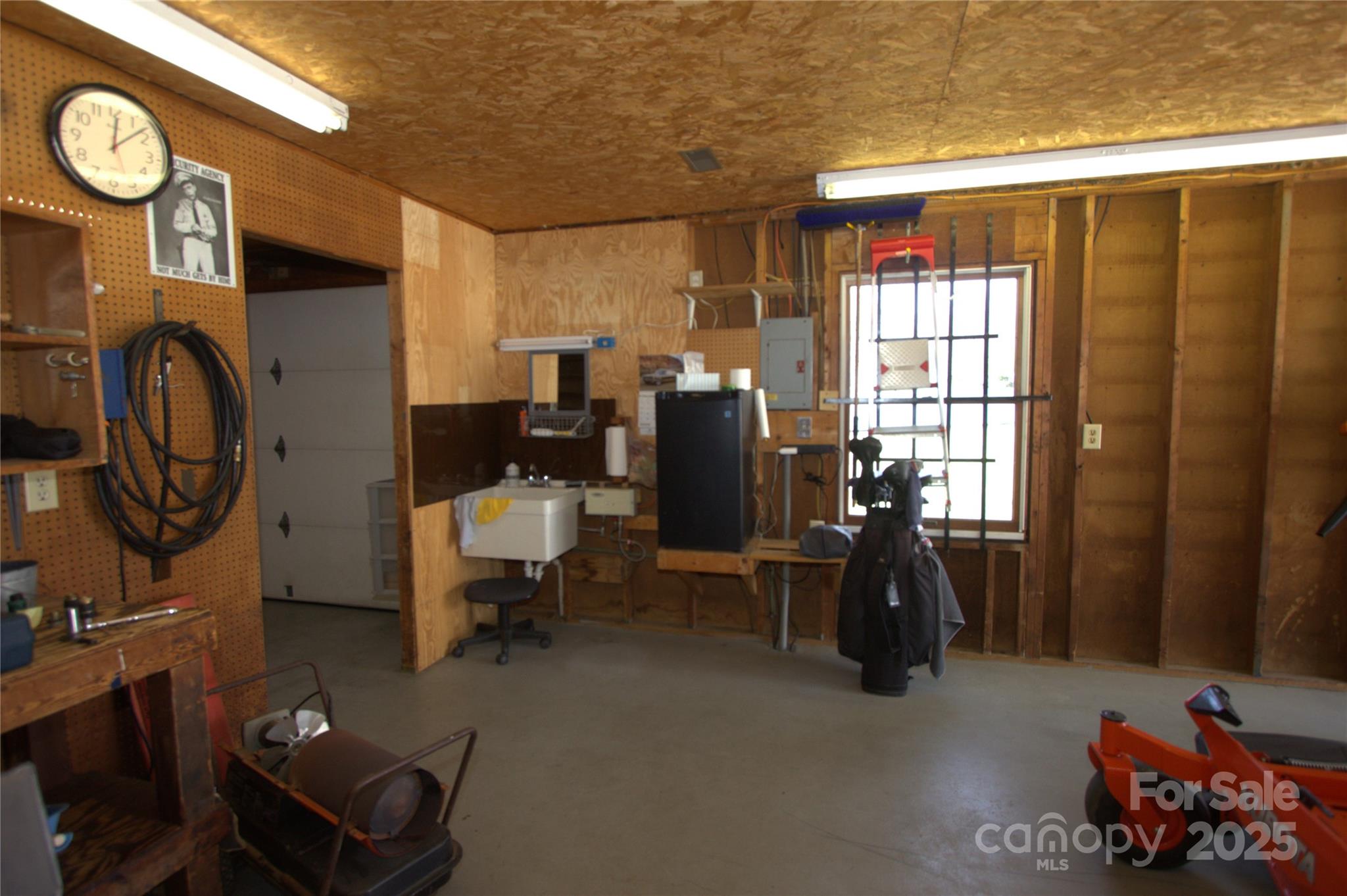 7169 Pleasant Grove Road Charlotte, NC 28216 - Photo 46 of 48 a room with gym equipment and a large window