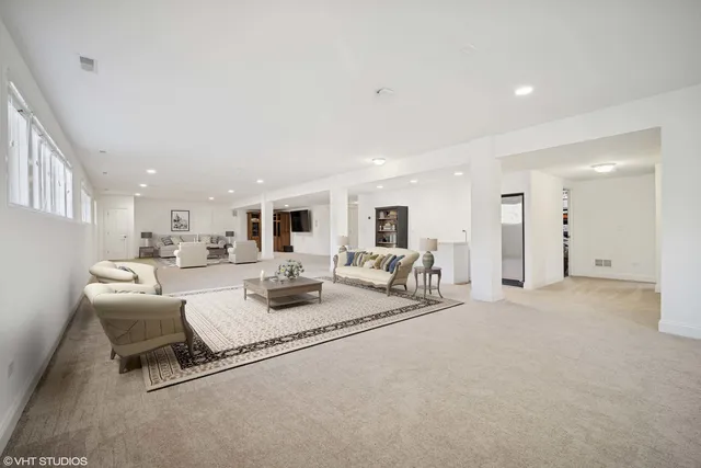 a living room with furniture and a table
