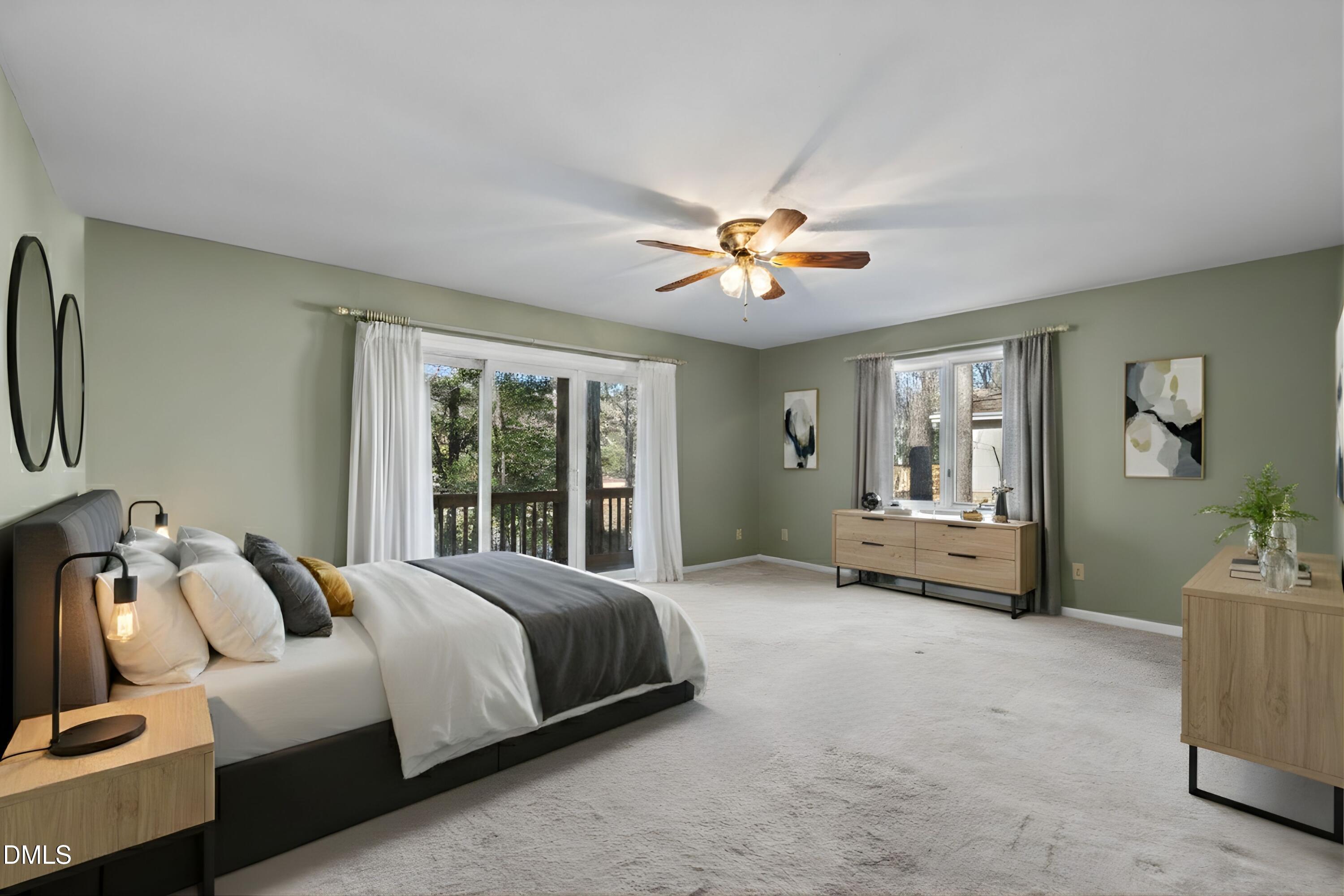 3113 Chipping Wedge Sanford, NC 27332 - Photo 10 of 42 a spacious bedroom with a bed and a chandelier