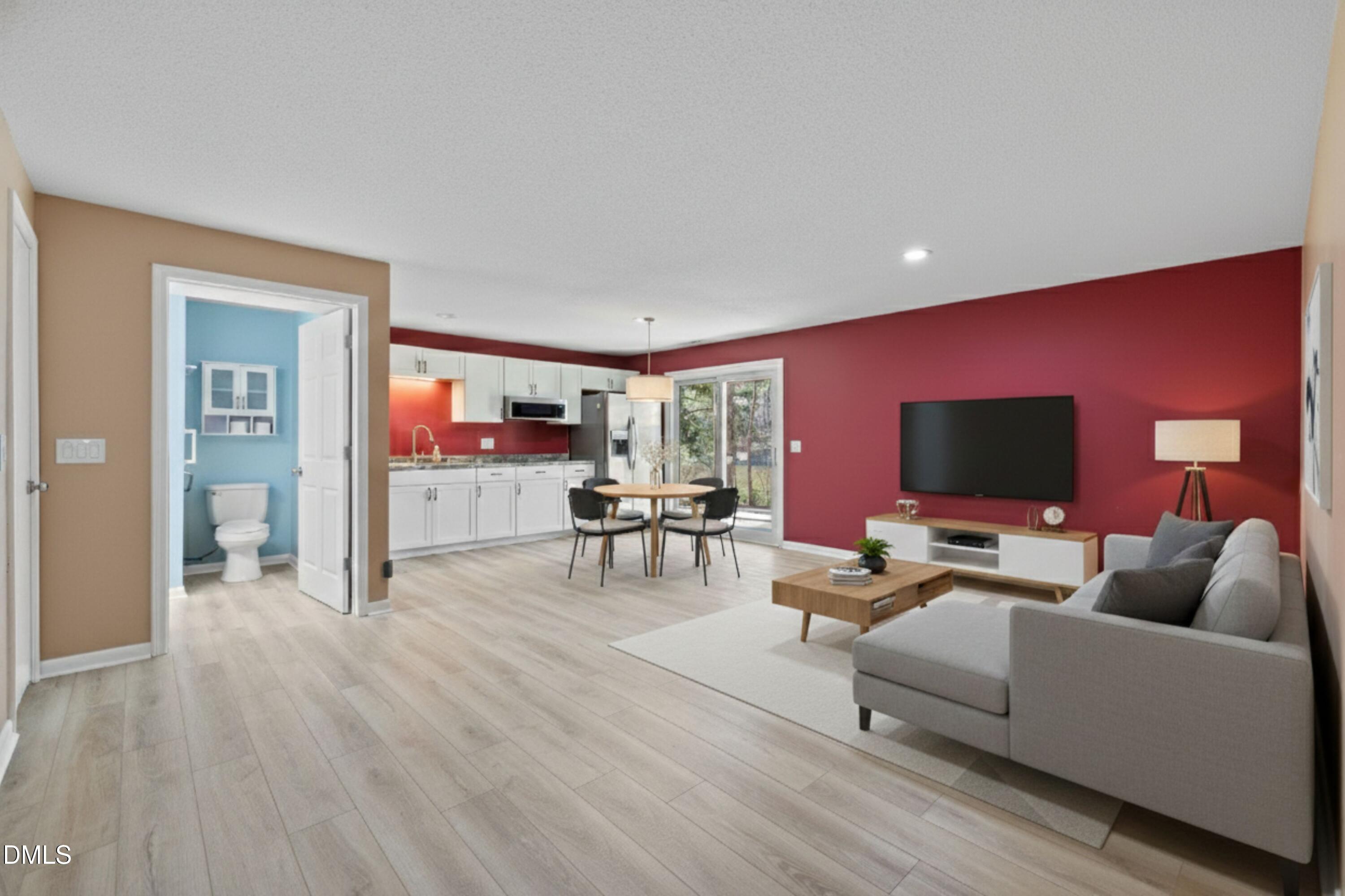 3113 Chipping Wedge Sanford, NC 27332 - Photo 17 of 42 a living room with furniture and a flat screen tv