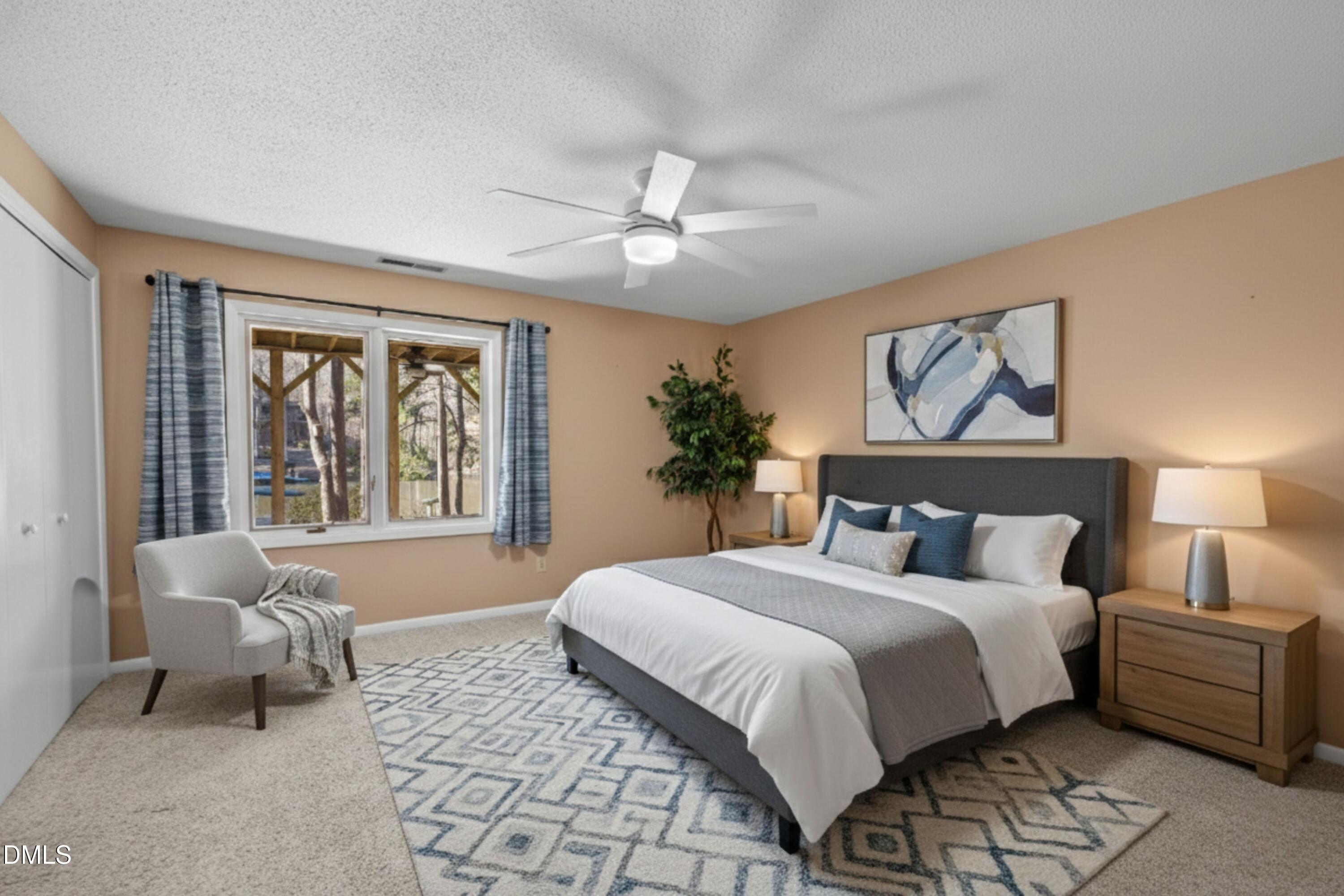 3113 Chipping Wedge Sanford, NC 27332 - Photo 20 of 42 a bedroom with a large bed couch and a window