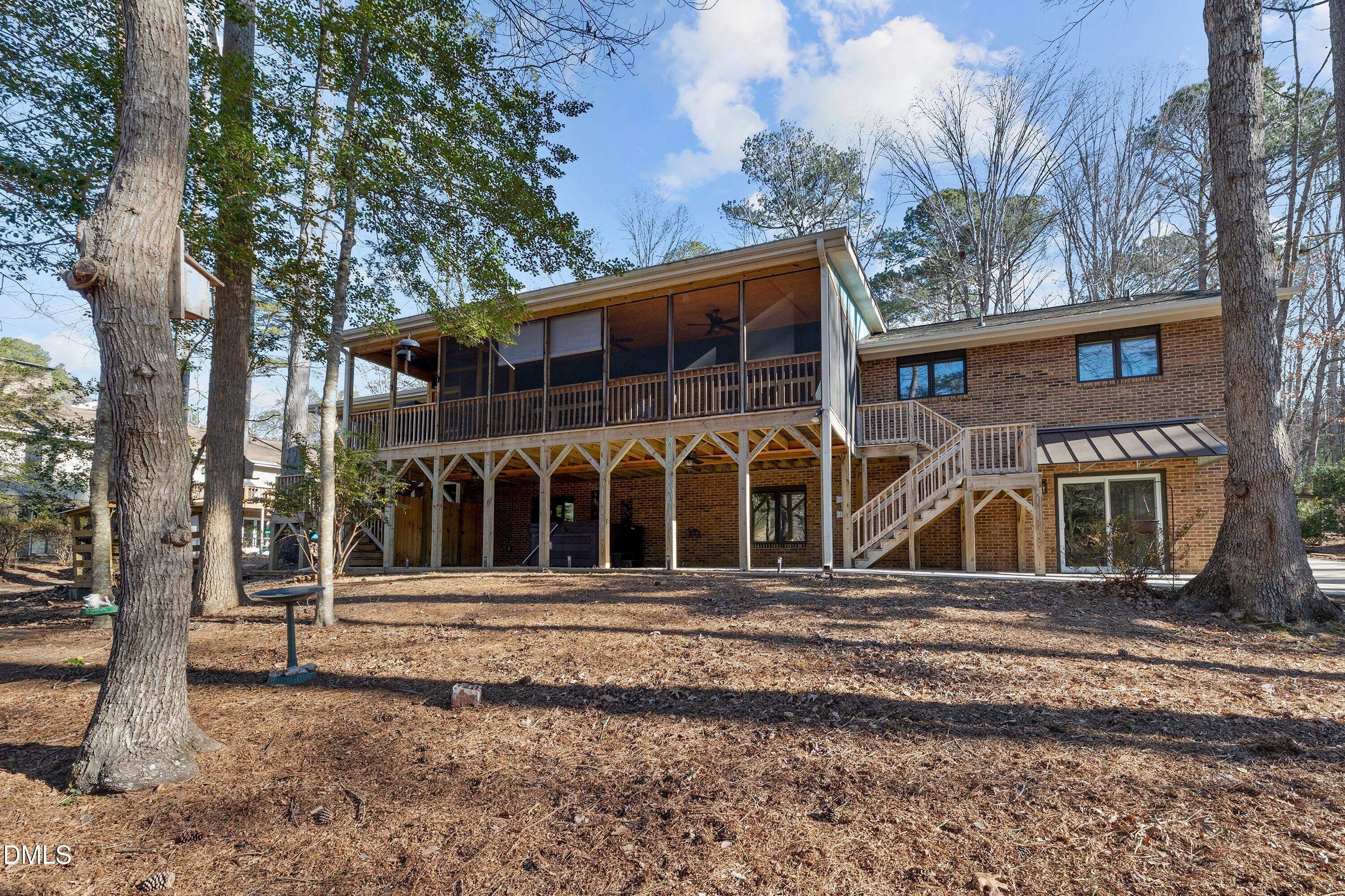 3113 Chipping Wedge Sanford, NC 27332 - Photo 25 of 42 a front view of a house with a small garden