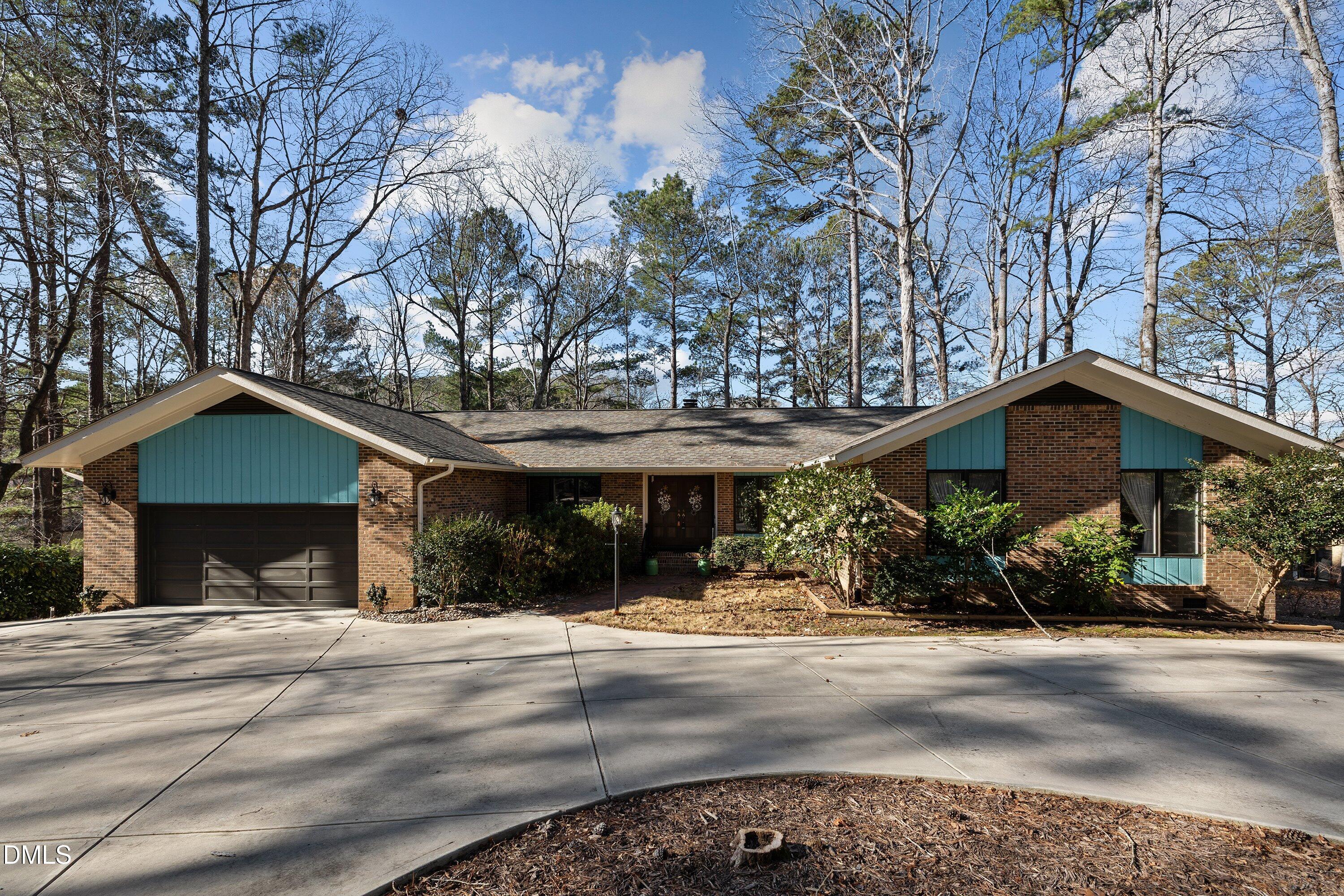 3113 Chipping Wedge Sanford, NC 27332 - Photo 29 of 42 a view of the house with a yard