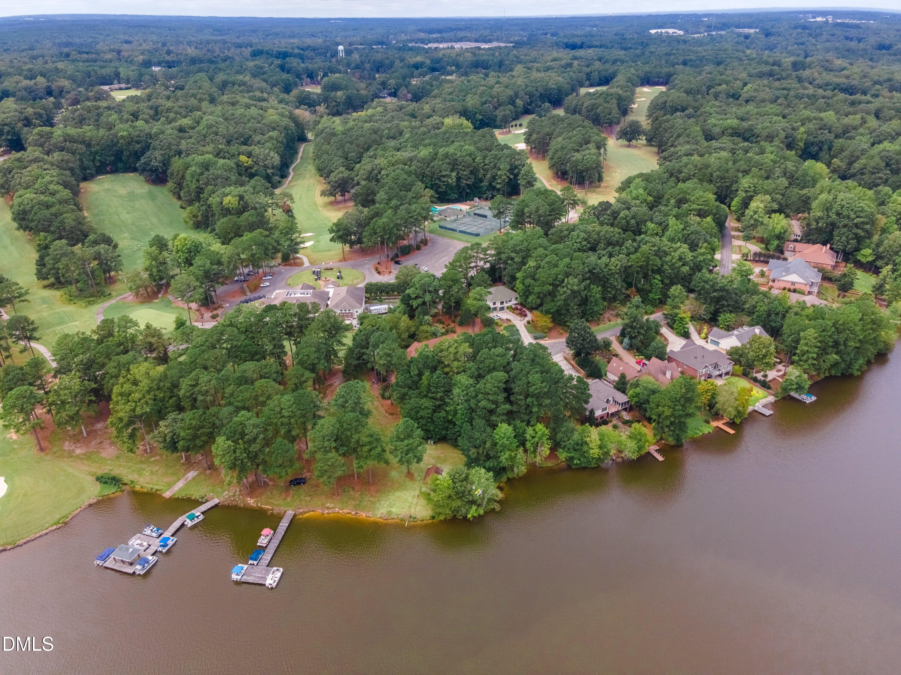 3113 Chipping Wedge Sanford, NC 27332 - Photo 33 of 42 an aerial view of a house with a yard and lake view