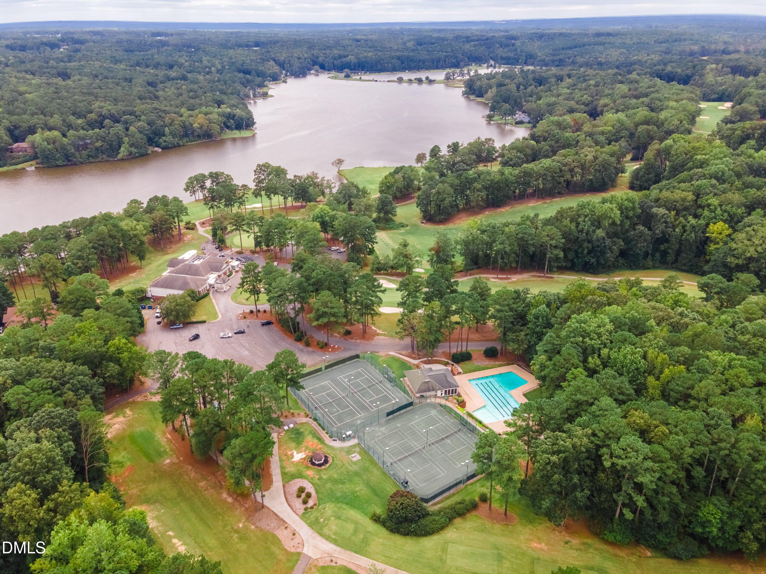 3113 Chipping Wedge Sanford, NC 27332 - Photo 34 of 42 an aerial view of a house with a lake view