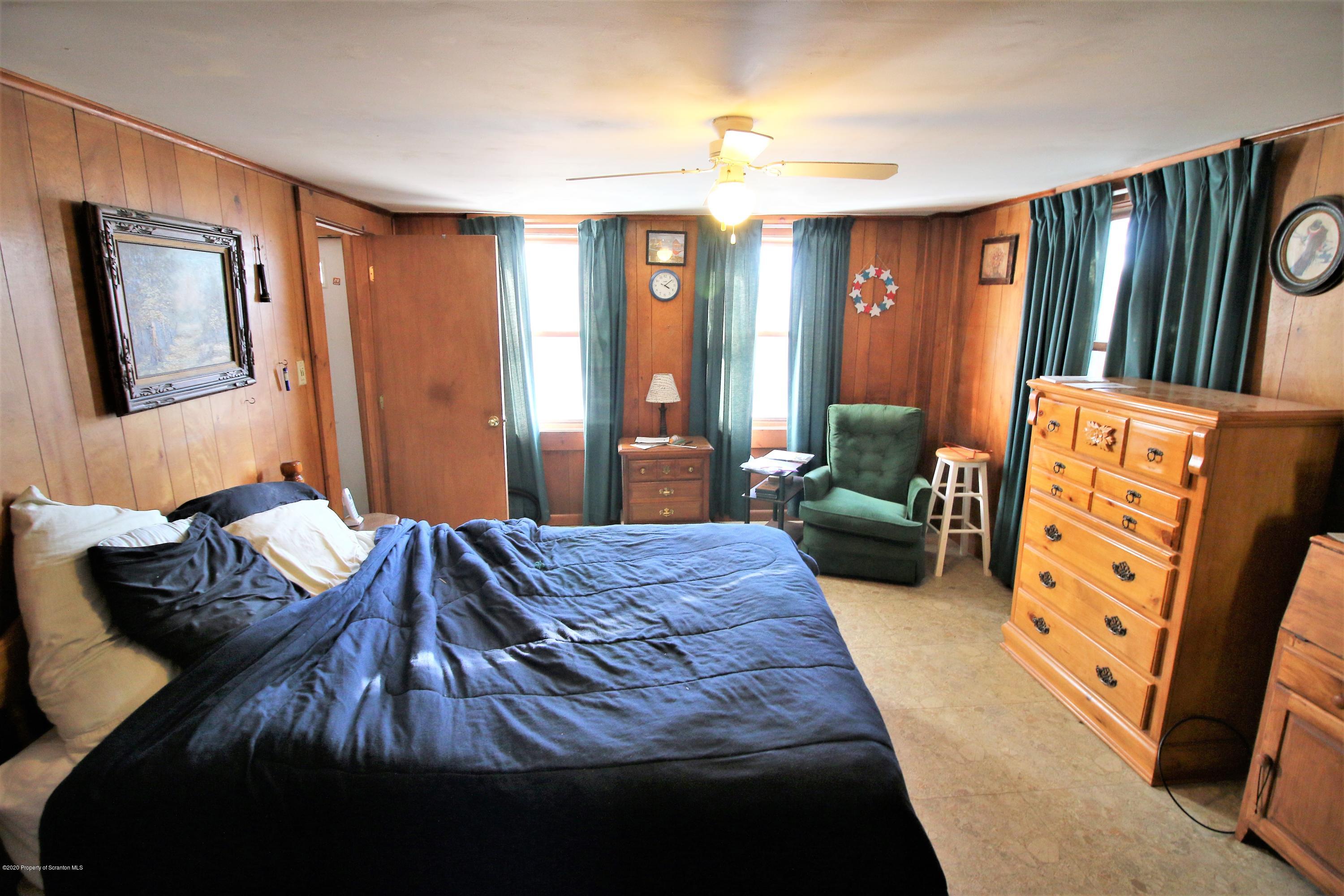 161 Spudeno Road Moscow, PA 18444 - Photo 12 of 16 a bedroom with bed and wooden floor