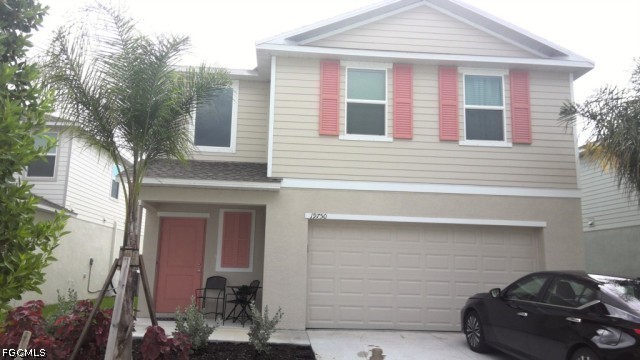 a front view of a house with parking