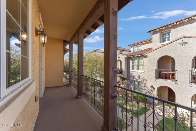 a view of a balcony with furniture