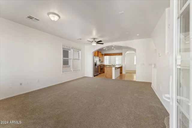 a big room with closet and windows