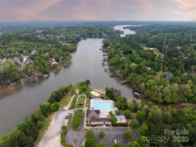 an aerial view of a house with a lake view