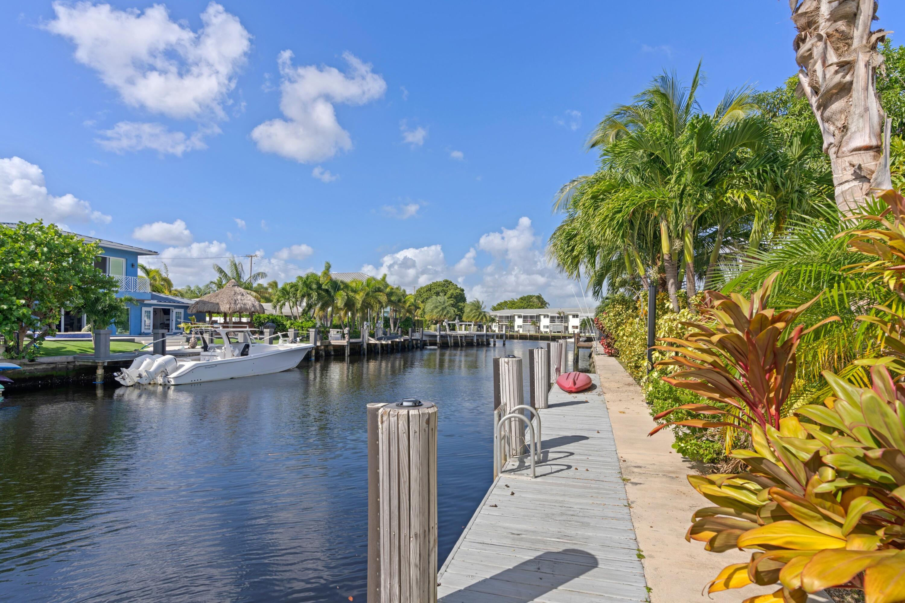391 Southeast 7th Avenue Pompano Beach, FL 33060 - Photo 11 of 38 a view of a lake with boats and trees in the background