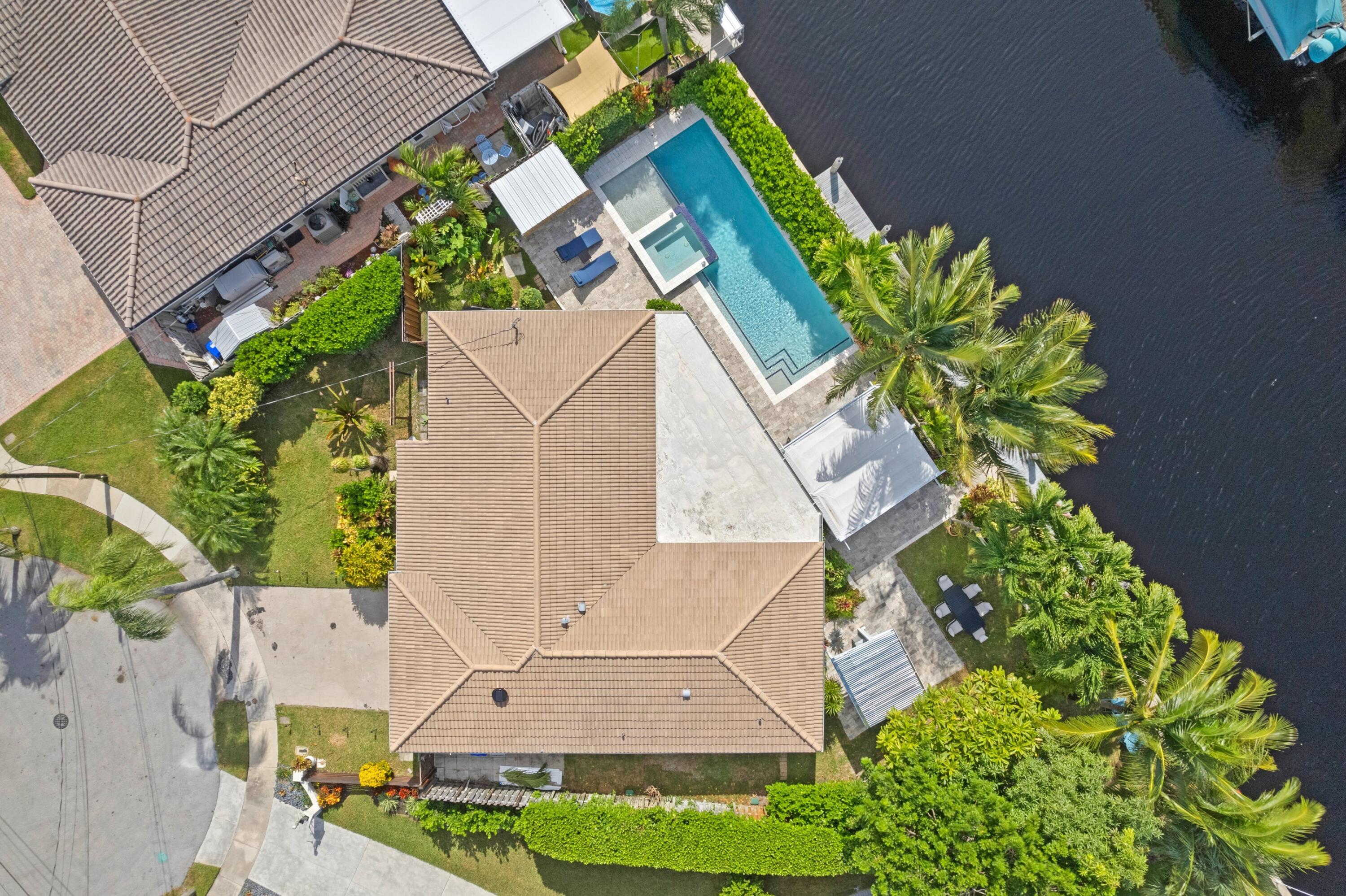 391 Southeast 7th Avenue Pompano Beach, FL 33060 - Photo 12 of 38 an aerial view of a house with a yard and garden