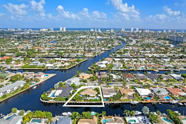 a large kitchen with stainless steel appliances kitchen island granite countertop a stove and a sink