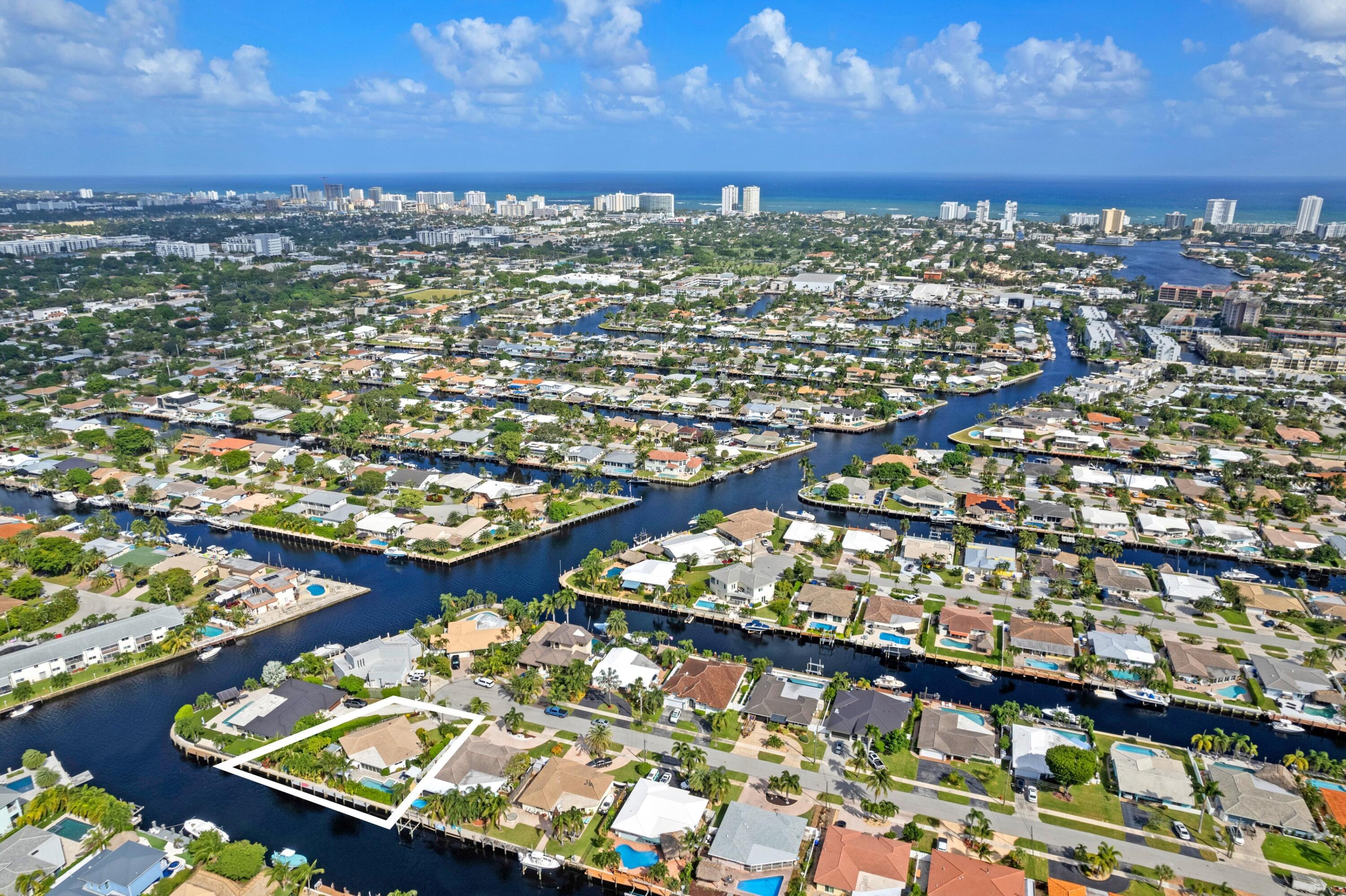 391 Southeast 7th Avenue Pompano Beach, FL 33060 - Photo 14 of 38 an aerial view of residential houses with outdoor space