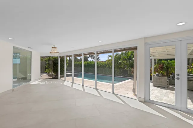 an empty room with large window