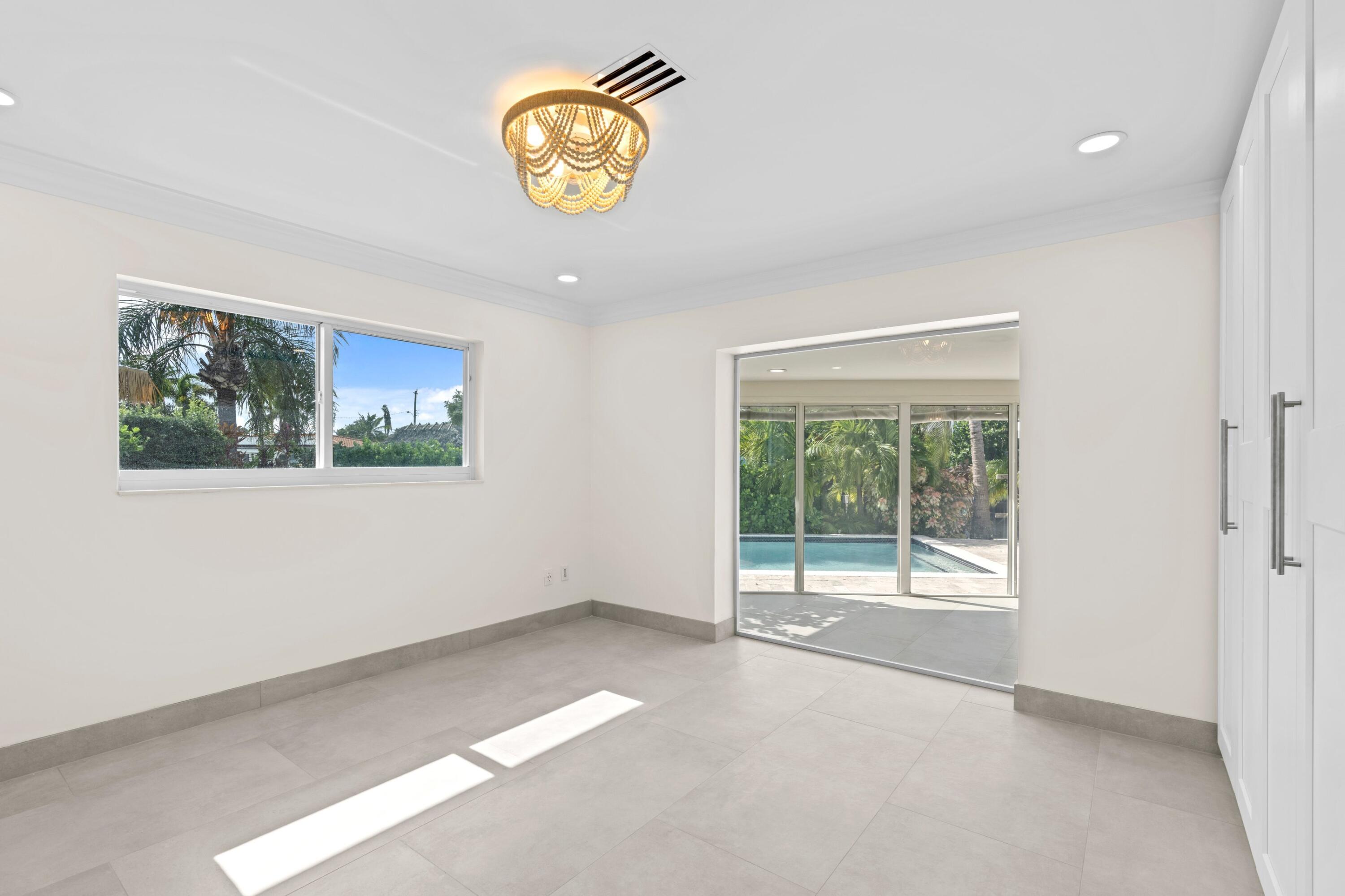 391 Southeast 7th Avenue Pompano Beach, FL 33060 - Photo 23 of 38 an empty room with a window