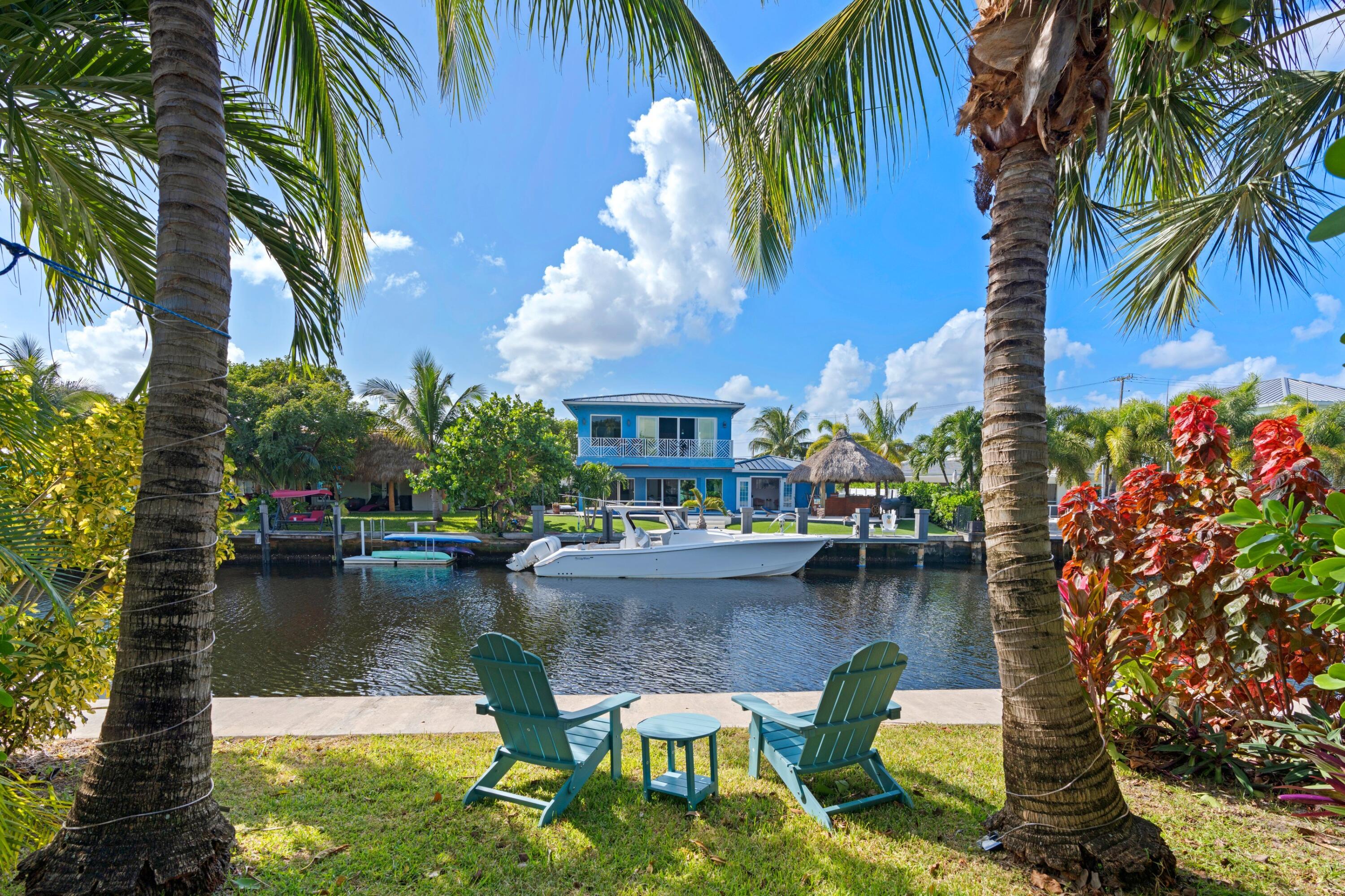 391 Southeast 7th Avenue Pompano Beach, FL 33060 - Photo 5 of 38 a view of swimming pool with outdoor seating and lake view