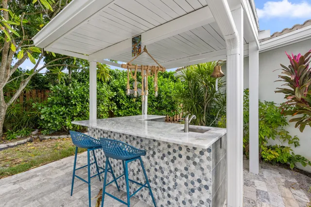 an empty room with fireplace and windows