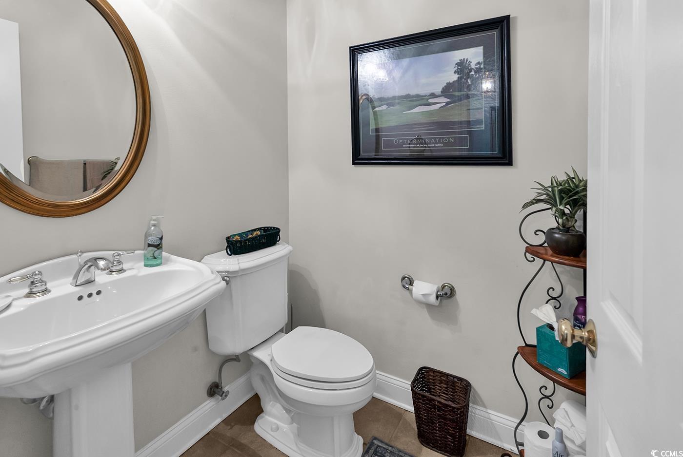 4507 Smilax Place Murrells Inlet, SC 29576 - Photo 15 of 39 Half bathroom featuring toilet and tile patterned floors
