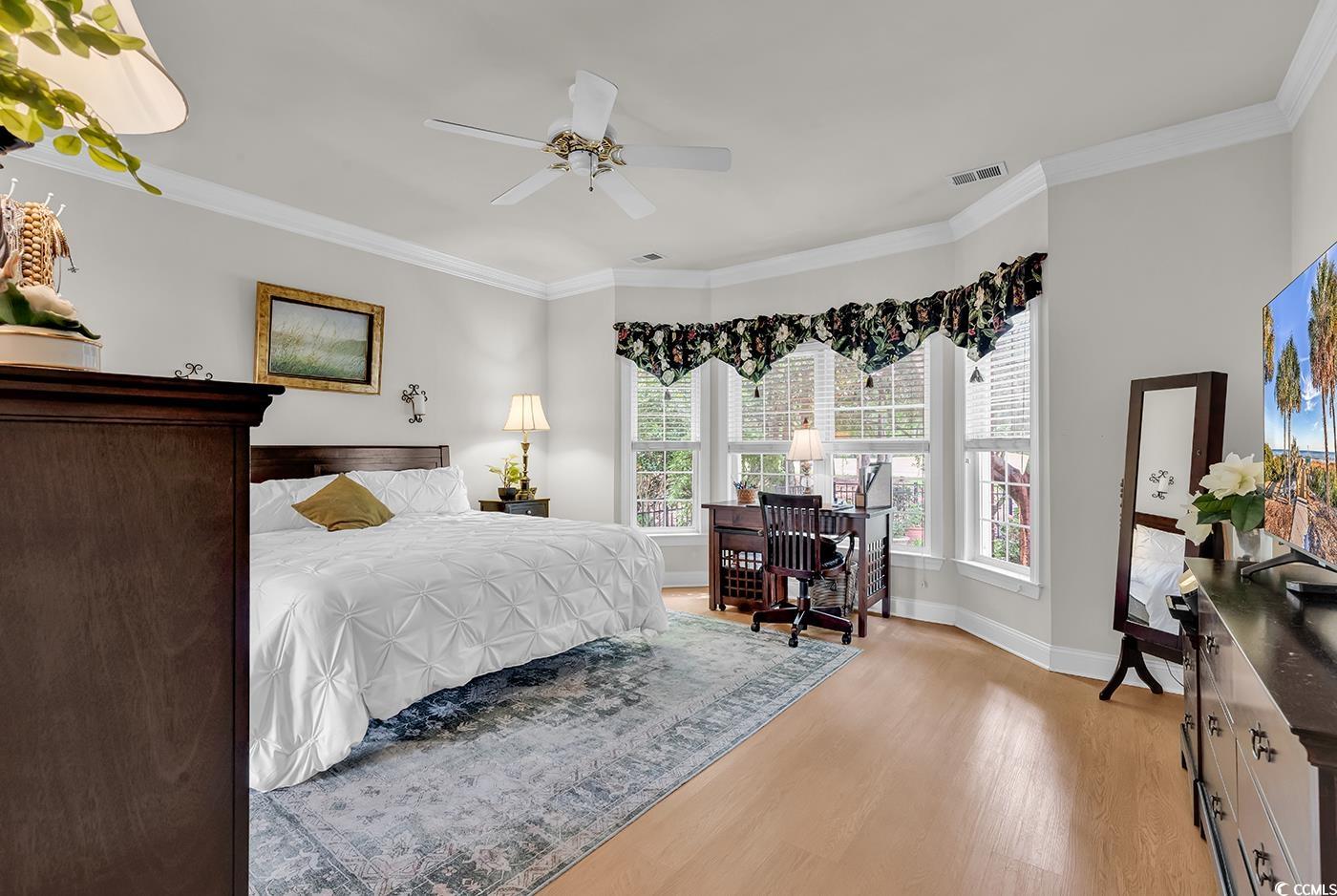 4507 Smilax Place Murrells Inlet, SC 29576 - Photo 16 of 39 Bedroom with light wood finished floors, crown molding, and a ceiling fan