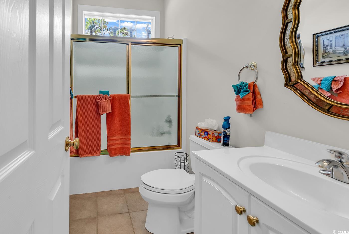 4507 Smilax Place Murrells Inlet, SC 29576 - Photo 25 of 39 Full bath featuring shower / bath combination with glass door, vanity, and tile patterned floors