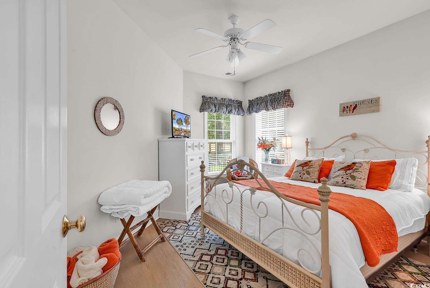 4507 Smilax Place Murrells Inlet, SC 29576 - Photo 27 of 39 Bedroom with a ceiling fan and wood finished floors
