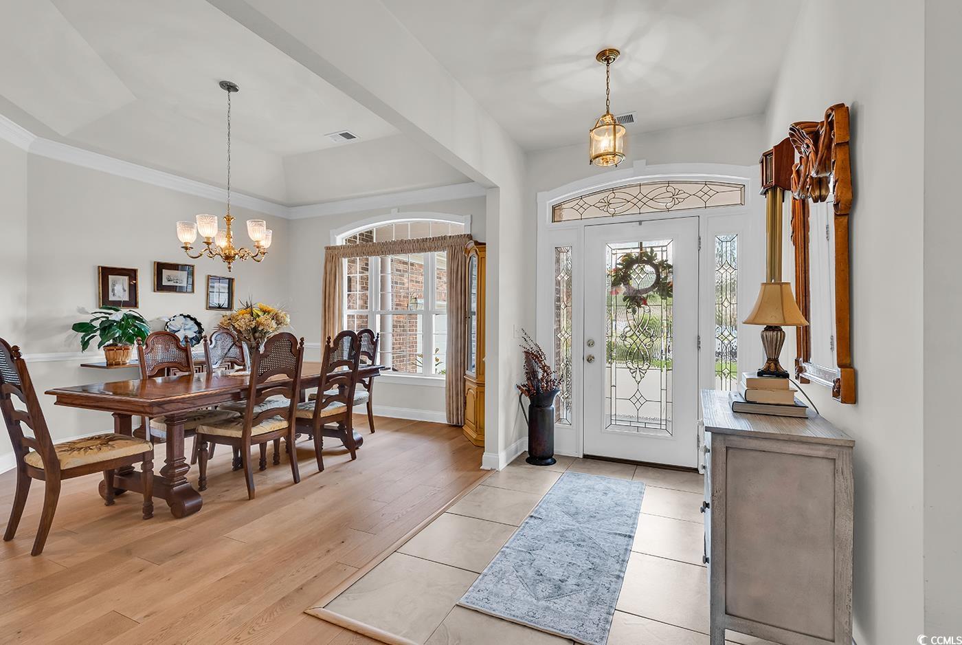 4507 Smilax Place Murrells Inlet, SC 29576 - Photo 3 of 39 Foyer featuring a chandelier and light wood-style floors