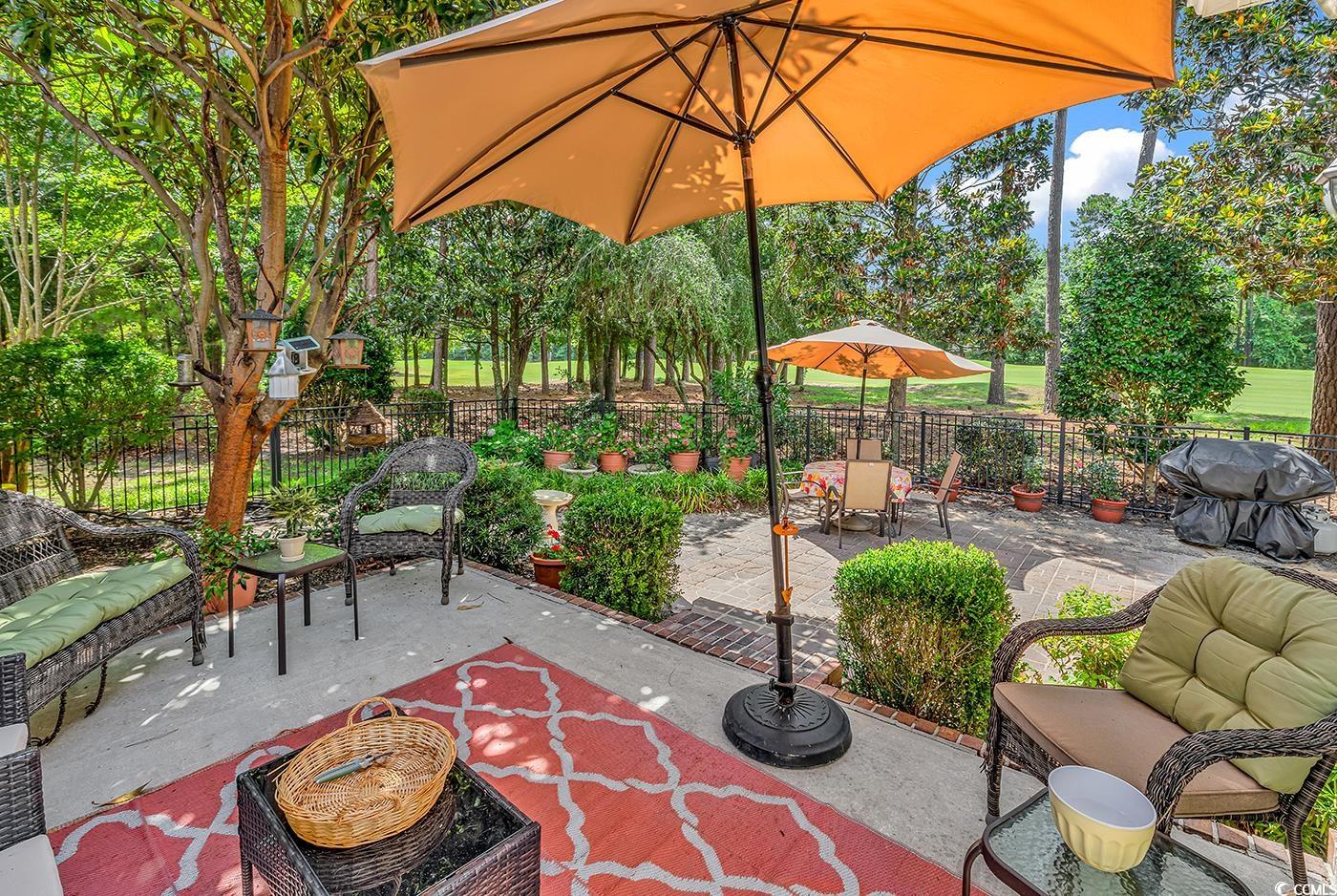 4507 Smilax Place Murrells Inlet, SC 29576 - Photo 35 of 39 Fenced backyard featuring a patio area, an outdoor hangout area, and grilling area