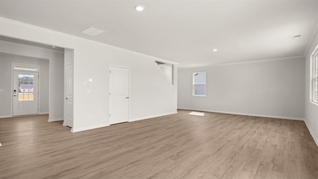 904 Sundown Point Villa Rica, GA 30180 - Photo 20 of 83 a view of an empty room with wooden floor and closet