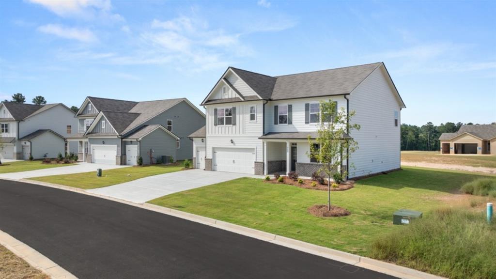 904 Sundown Point Villa Rica, GA 30180 - Photo 2 of 83 a view of a house with a big yard and large trees