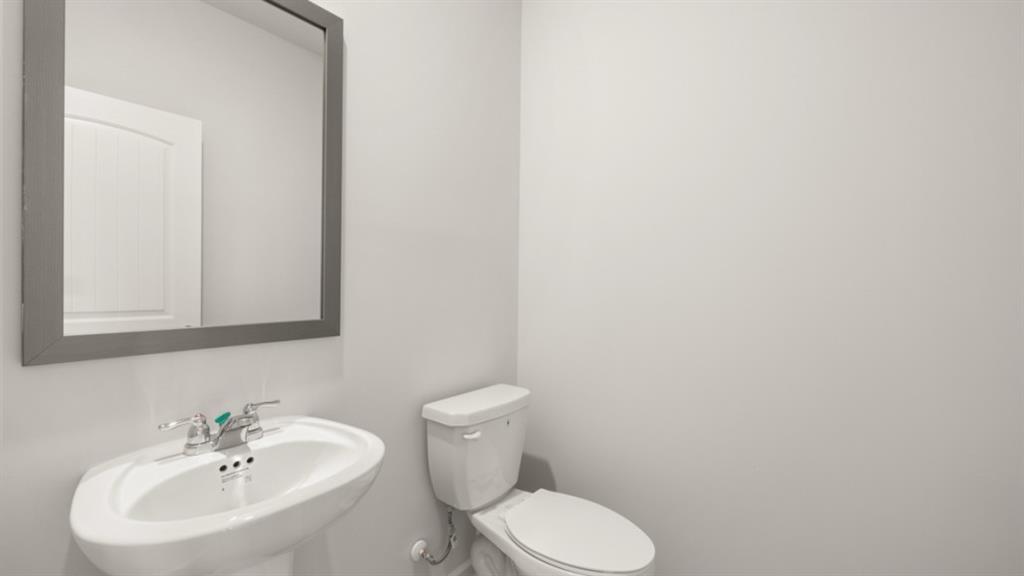 904 Sundown Point Villa Rica, GA 30180 - Photo 24 of 83 a white toilet sitting next to a white sink