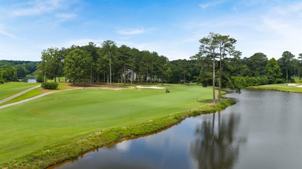904 Sundown Point Villa Rica, GA 30180 - Photo 77 of 83 a view of a golf course with a lake